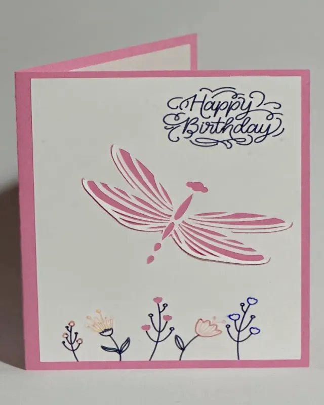 handmade birthday card with intricate cut and layered