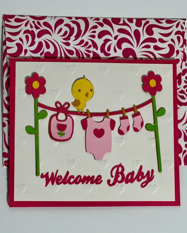 handmade new born card with intricate cuts, layered elements