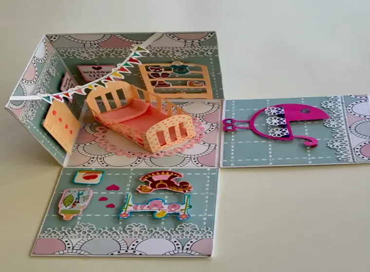 handmade new born card with intricate cuts, layers and embellishments