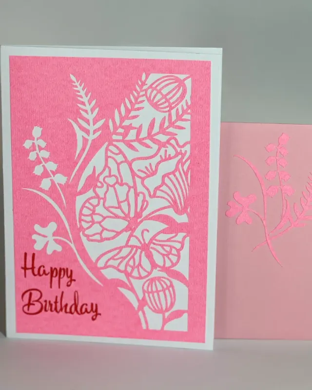 handmade birthday card with intricate cuts and designs